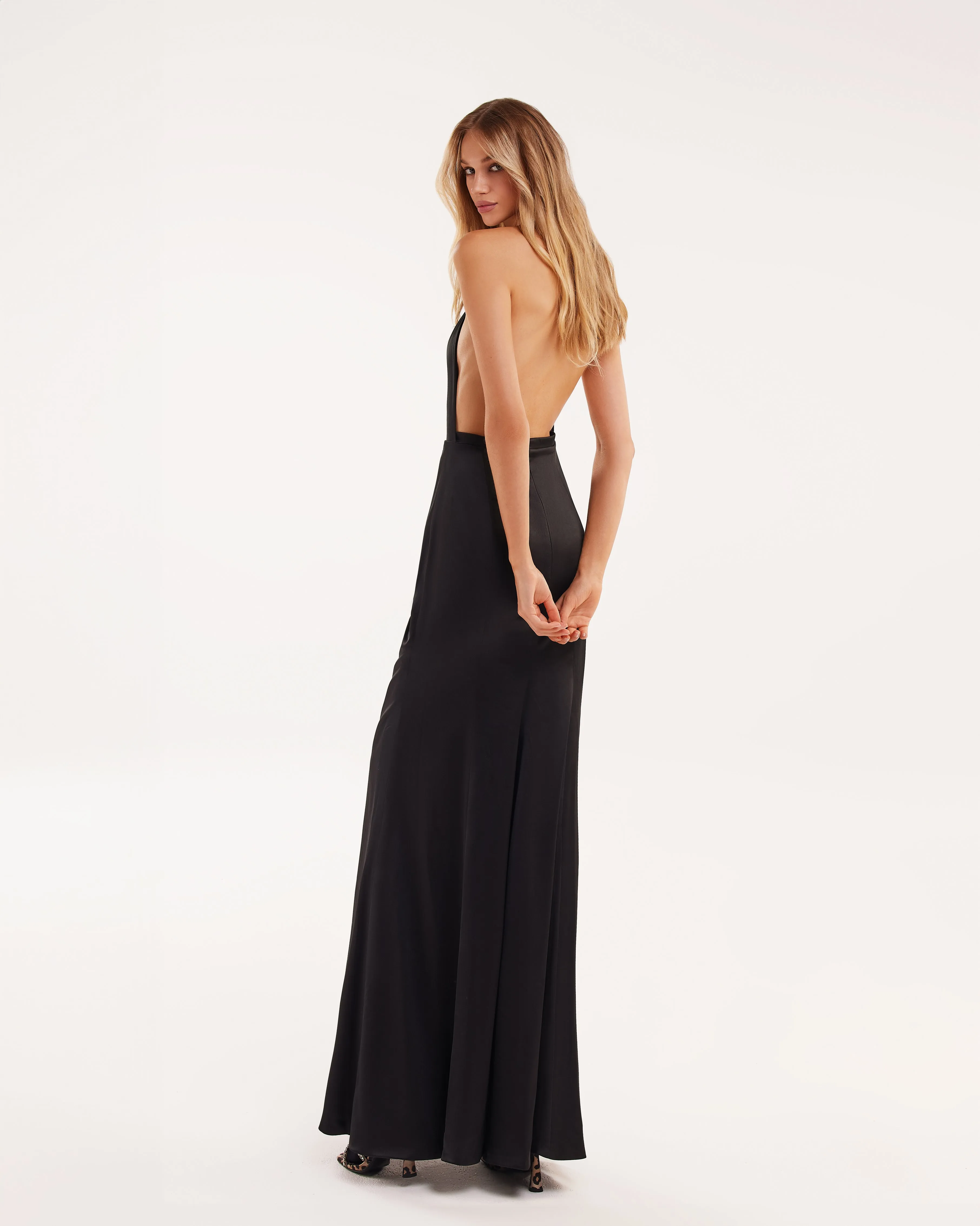 black sleeveless dress with low slit