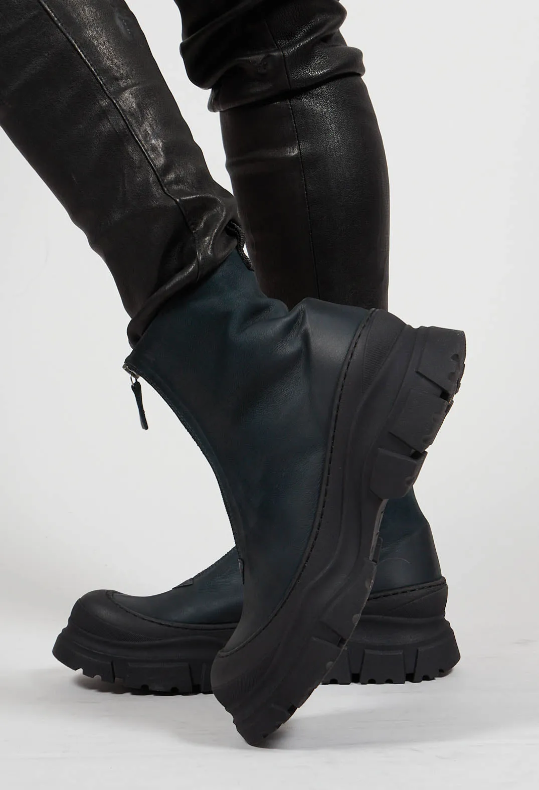 Gasoline blue-green ankle boots with zip front.