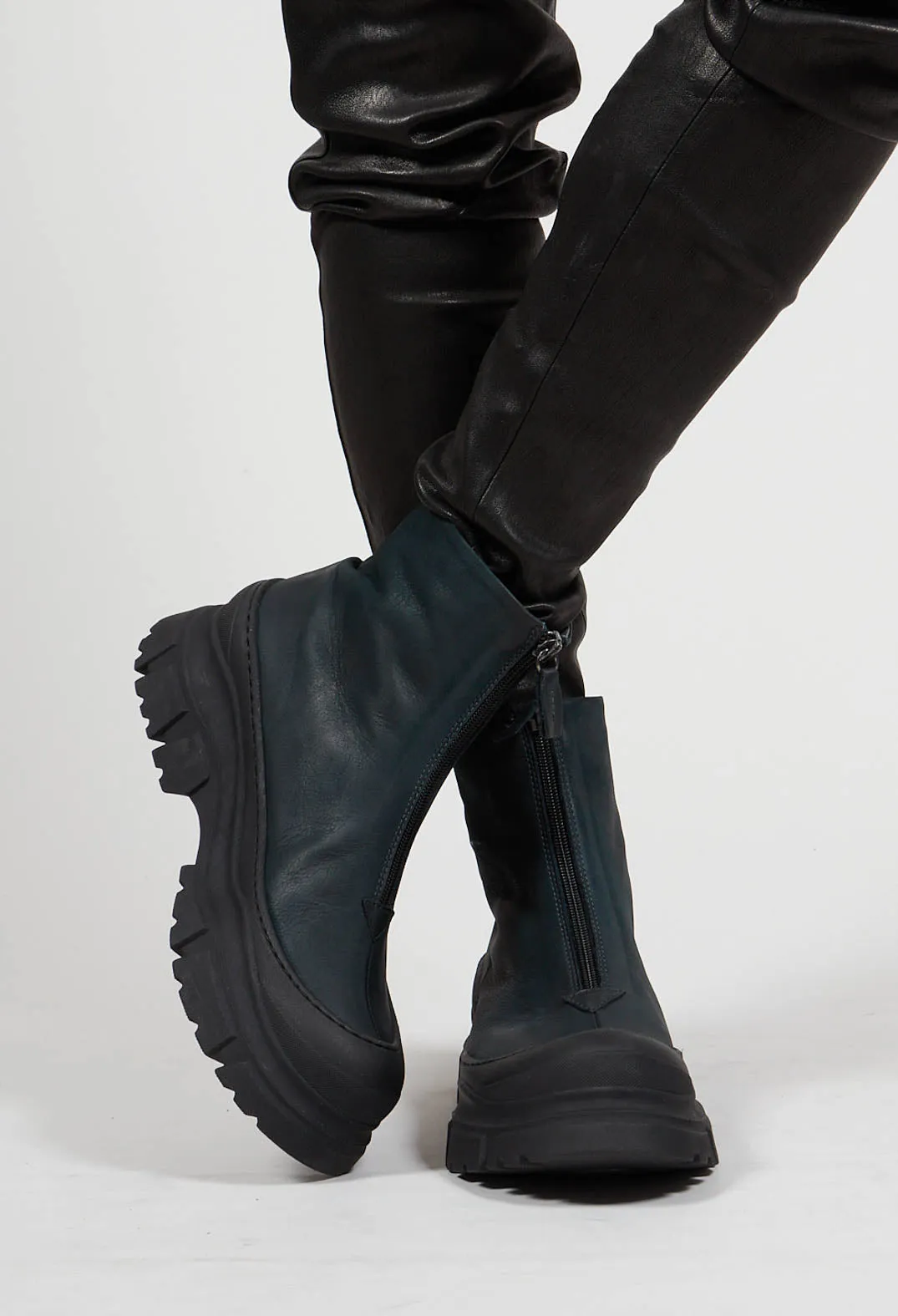 Gasoline blue-green ankle boots with zip front.