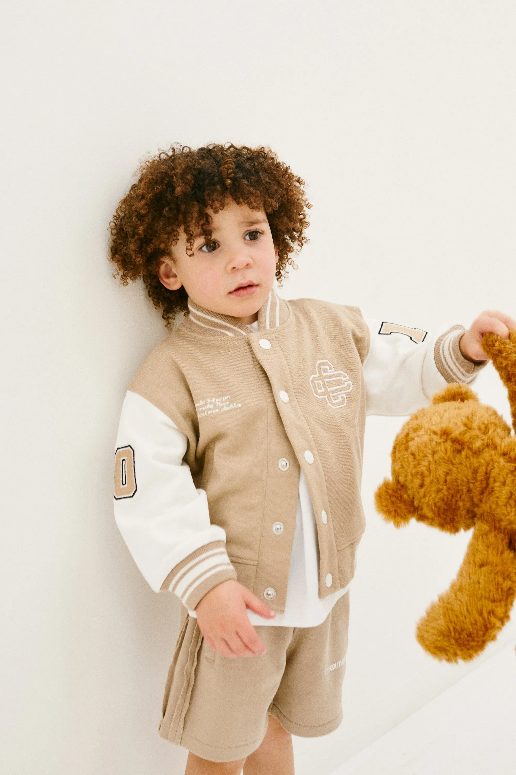 KIDS EMBLEM VARSITY BOMBER JACKET - BEIGE