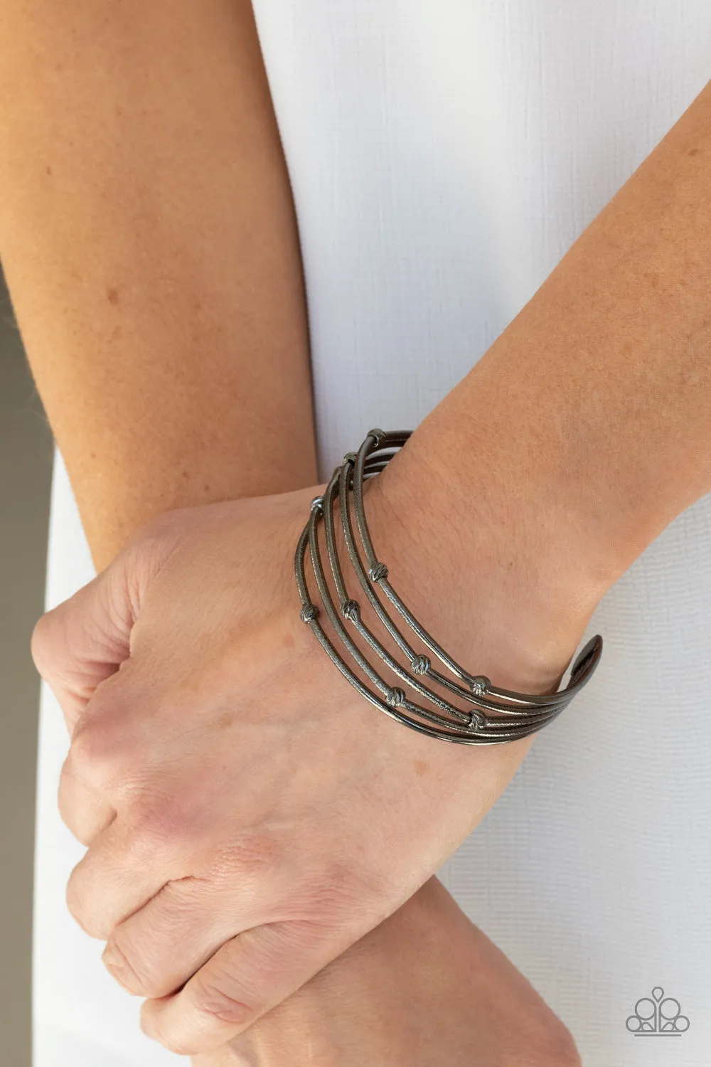 Metallic Music: Black Bracelet - Embrace the boldness!