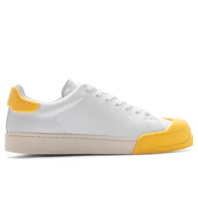 White and Yellow Leather Sneakers.