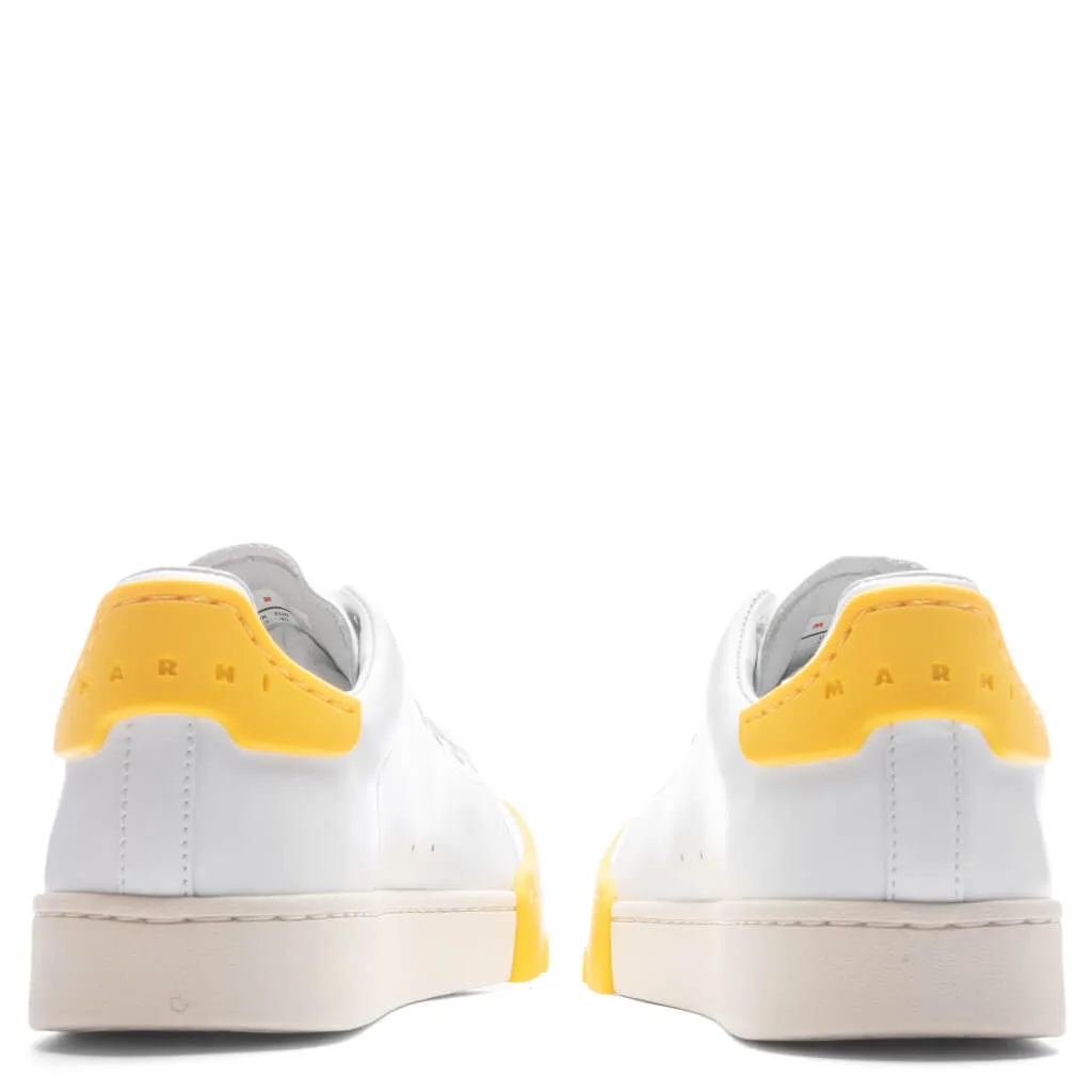 White and Yellow Leather Sneakers.